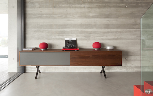 Geneva AeroSphere small speakers in red with base station